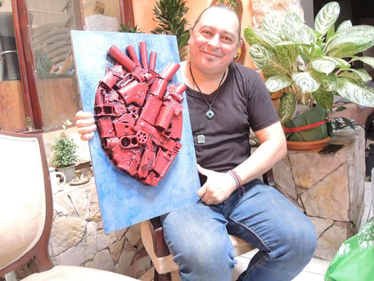 Colorful peace-themed artwork displayed in gallery at Juan Santamaria Museum in Costa Rica