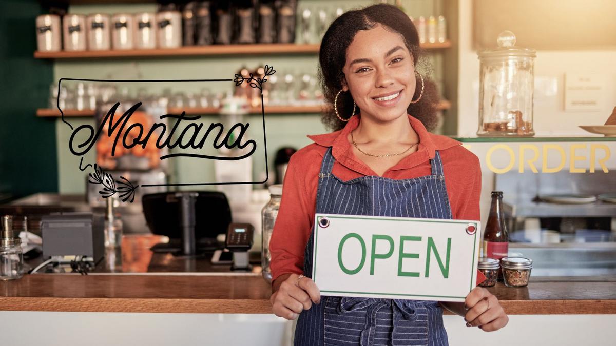 ** Downtown Montana main street with small business storefronts and mountain views in background