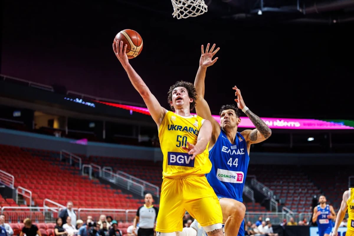 Ukrainian basketball players celebrating victory during 2027 World Cup qualifying match against Greece