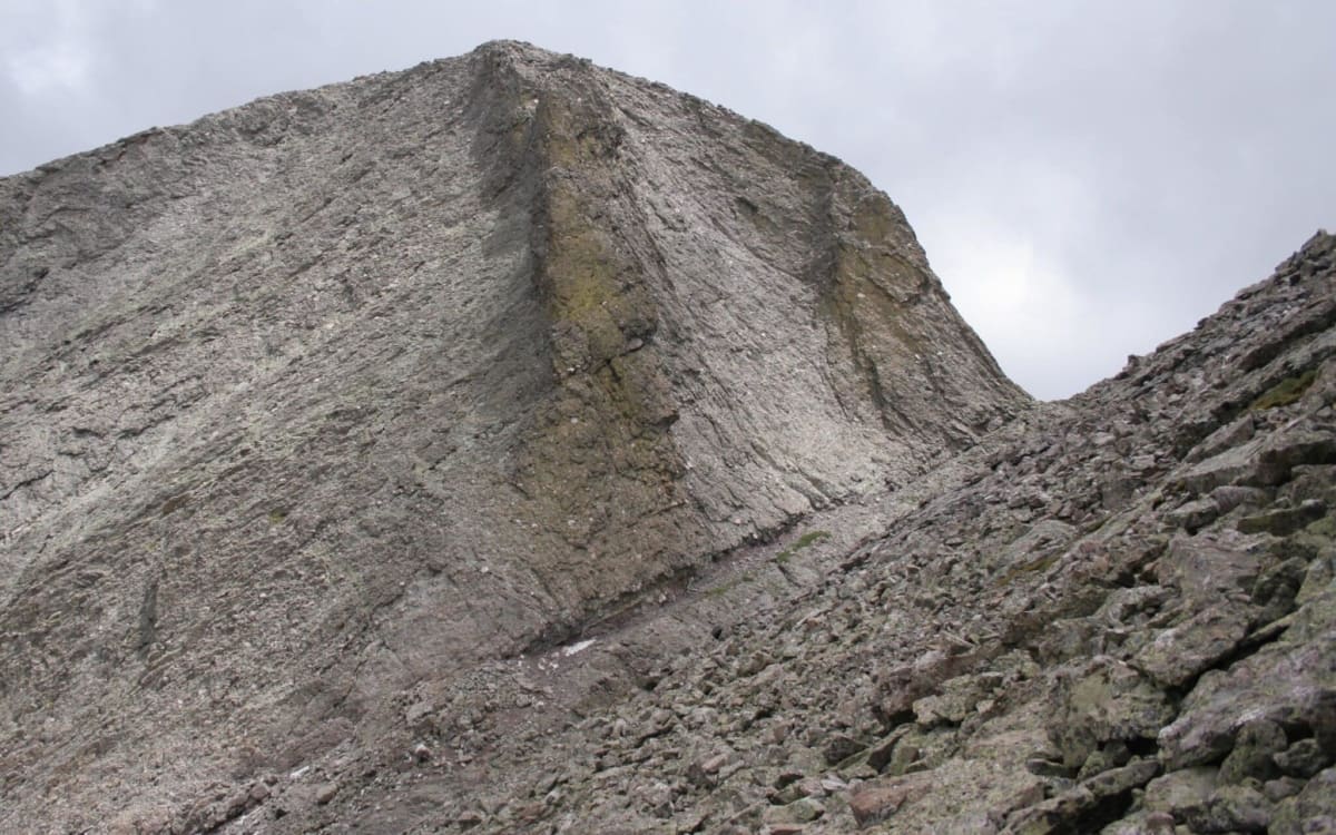 Search and rescue team performing technical rope rescue in Colorado mountain snowfield