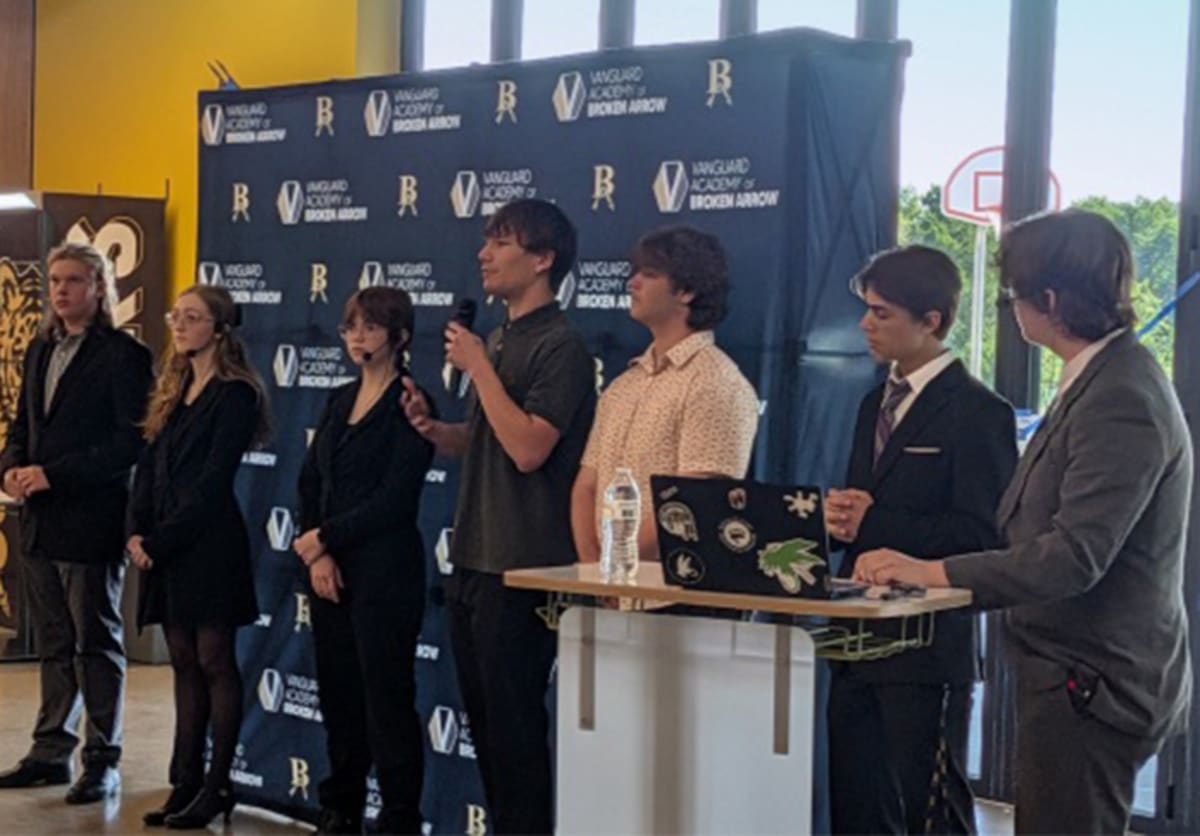 High school students presenting business ideas to judges at University of Tulsa Innovation Challenge