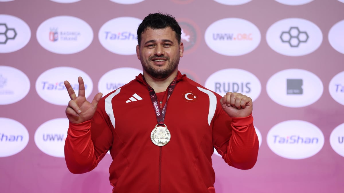 Turkish wrestler Riza Kayaalp celebrating with raised arm after winning 13th European Championship gold medal