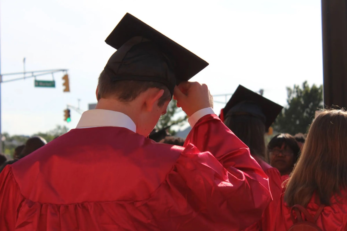 Students in graduation caps celebrating at Columbia High School scholarship reception ceremony