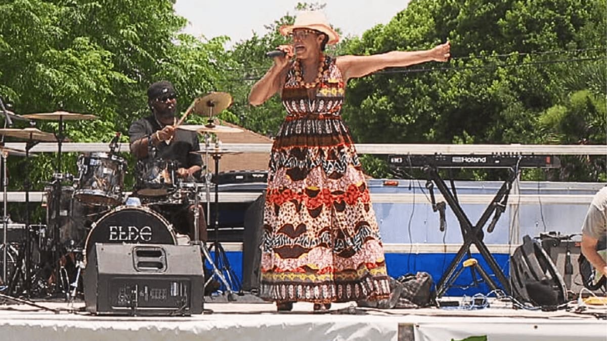 Diverse crowd of families enjoying outdoor Juneteenth Unity Fest celebration in Pensacola Florida