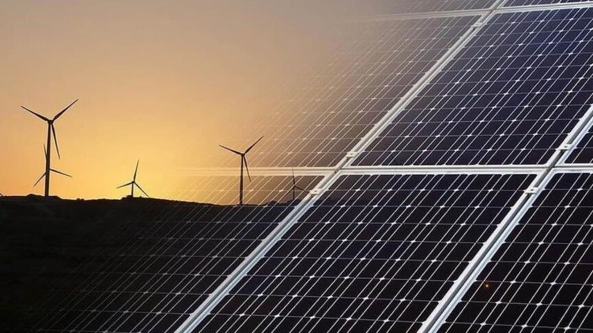 Green technology startup founders collaborating on renewable energy solutions in modern office space