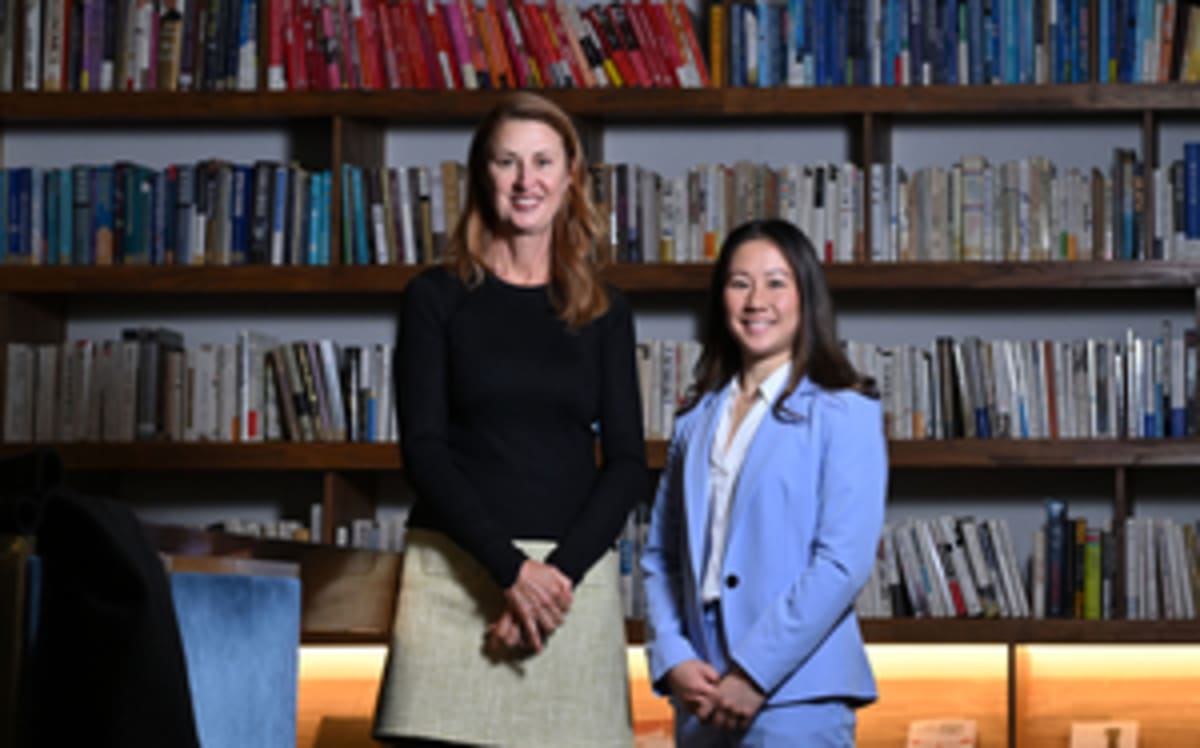 Kim Bui and Rosemary Purcell standing together in Seoul discussing athlete mental health reform
