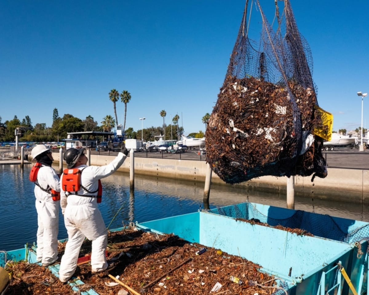 Interceptor device floating in Ballona Creek collecting plastic waste before it reaches the ocean