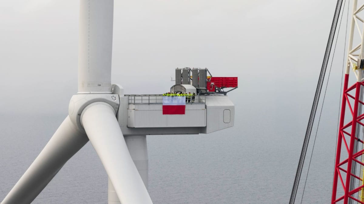 Offshore wind turbines standing in Baltic Sea waters near Polish coastline at sunrise