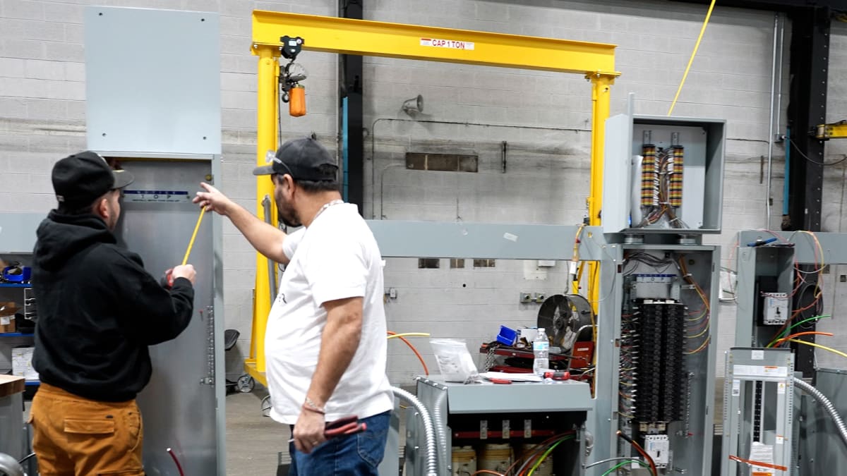 ** Workers assembling modular power systems at manufacturing facility in Cudahy, Wisconsin