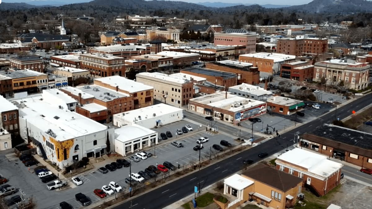 Aerial drone view of downtown Hendersonville, North Carolina nestled in mountain valley
