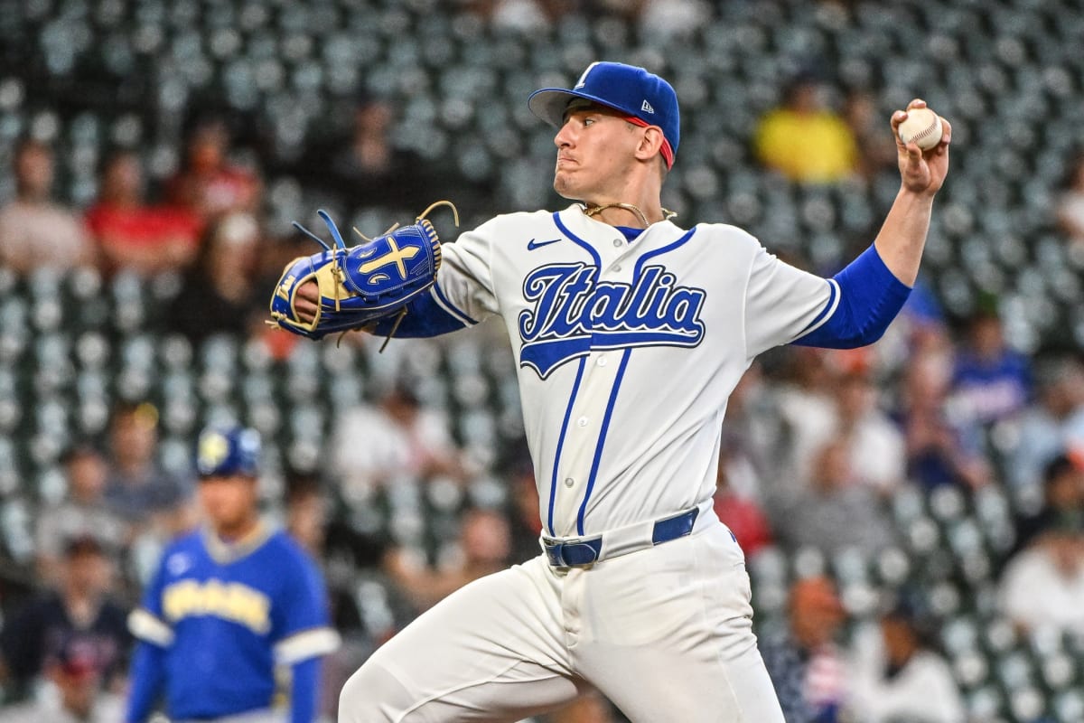 Samuel Aldegheri pitching for Italy in blue uniform at World Baseball Classic