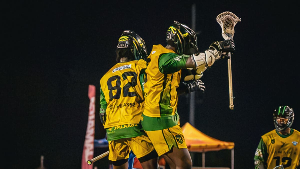 Lacrosse players celebrate on field after qualifying for 2027 world championship tournament