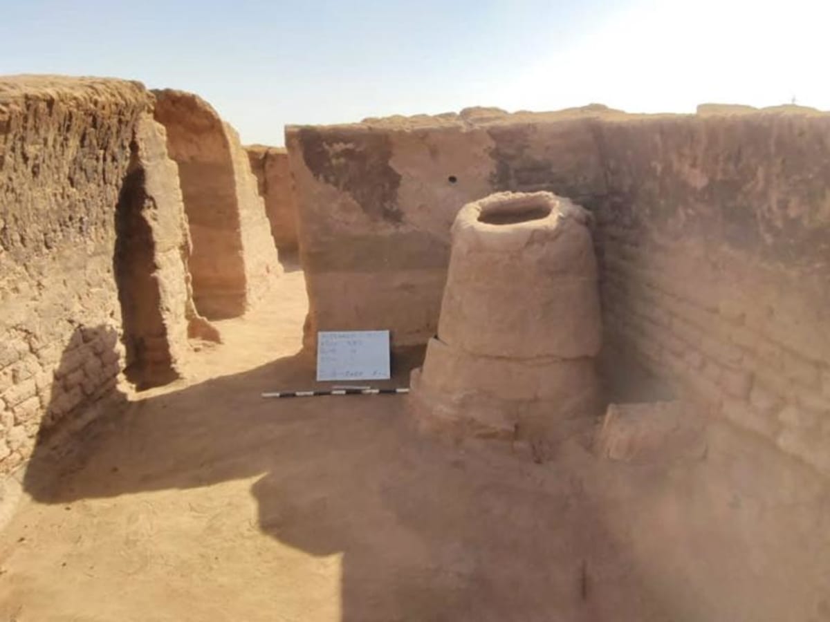 Aerial view of ancient mud-brick ruins showing organized street layout of 1,700-year-old Christian city in Egyptian desert