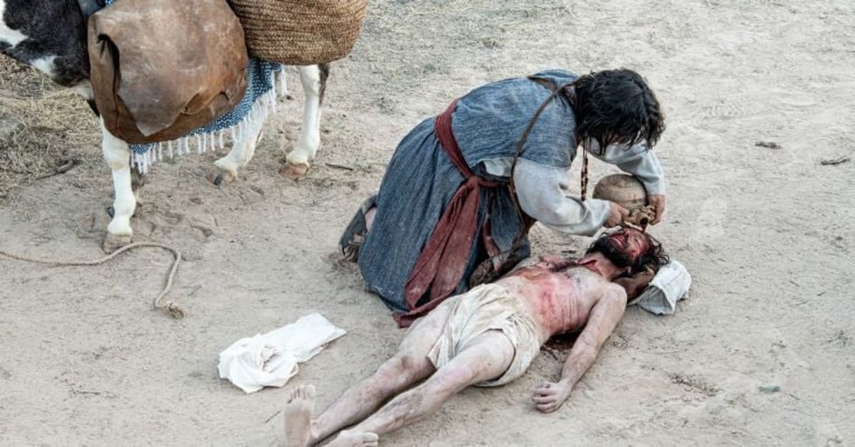 Actor draped across donkey in biblical desert scene from Good Samaritan film