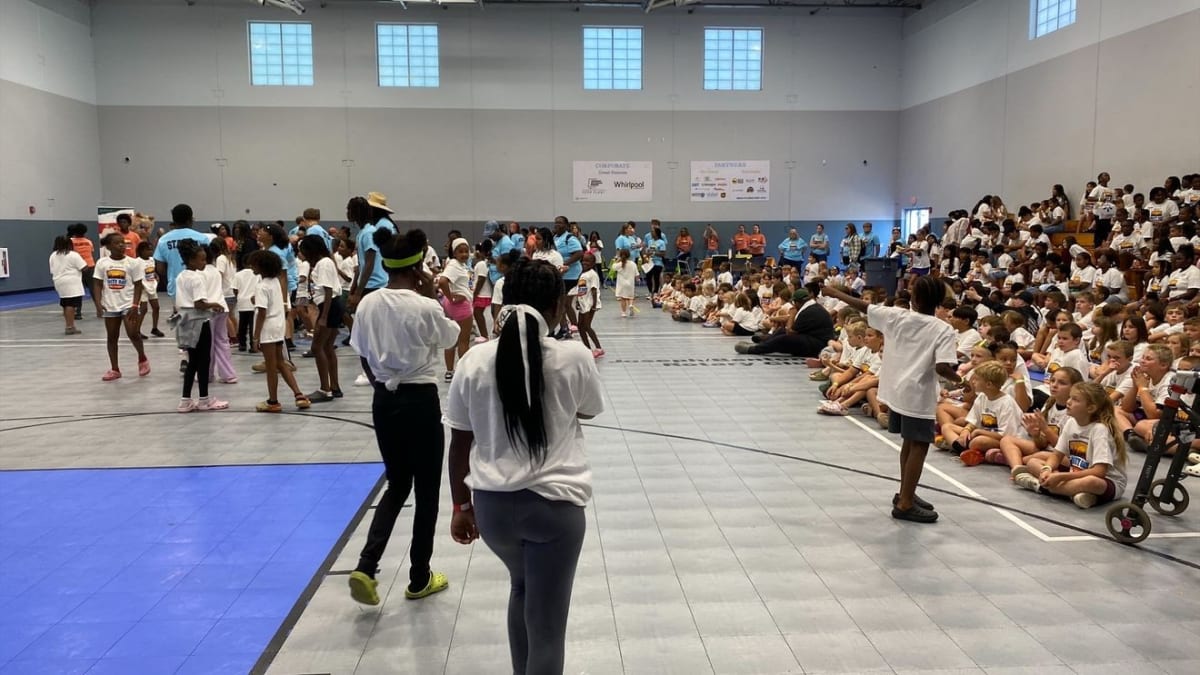Kids participating in outdoor summer activities at Boys & Girls Club Unity Day celebration in Benton Harbor