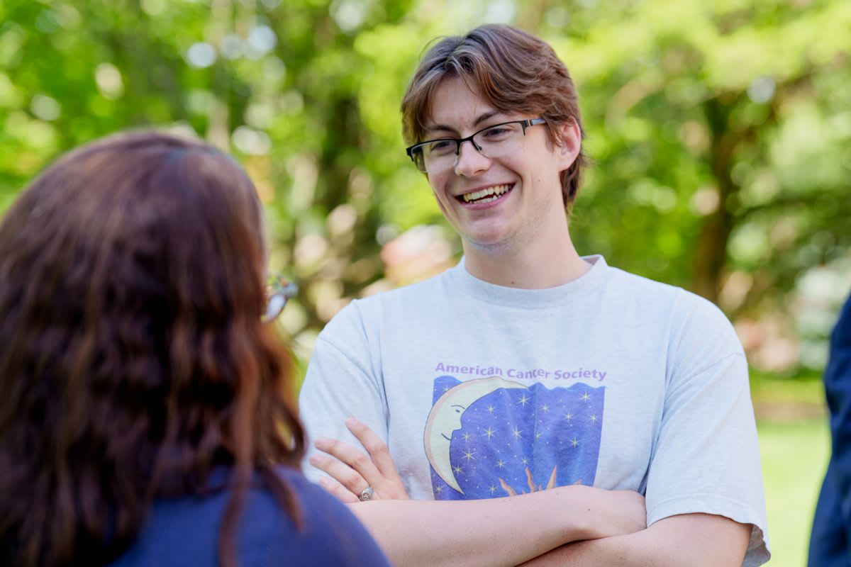 Colin Street, WVU junior and student government president, smiling outdoors on campus