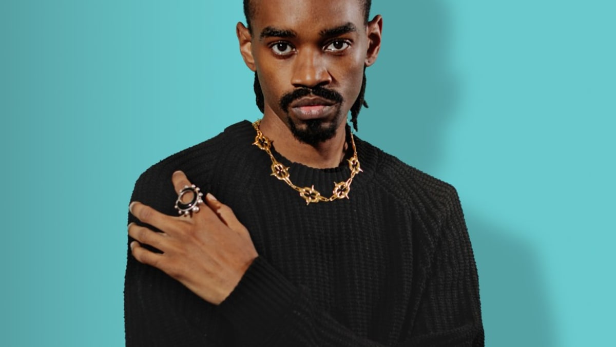 Jewelry designer Jameel Mohammed, inaugural Tiffany and CFDA award recipient, holding his award