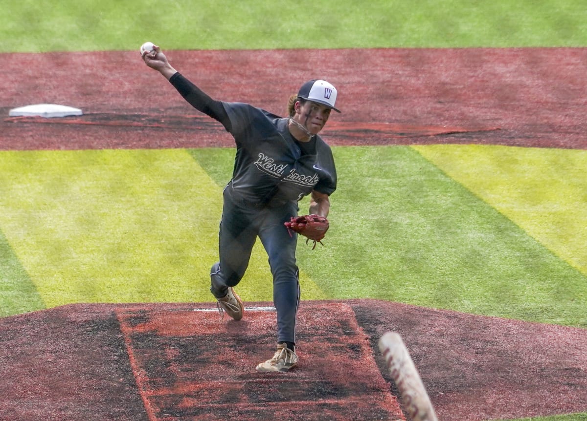 High school baseball team celebrates state championship victory on field with trophy