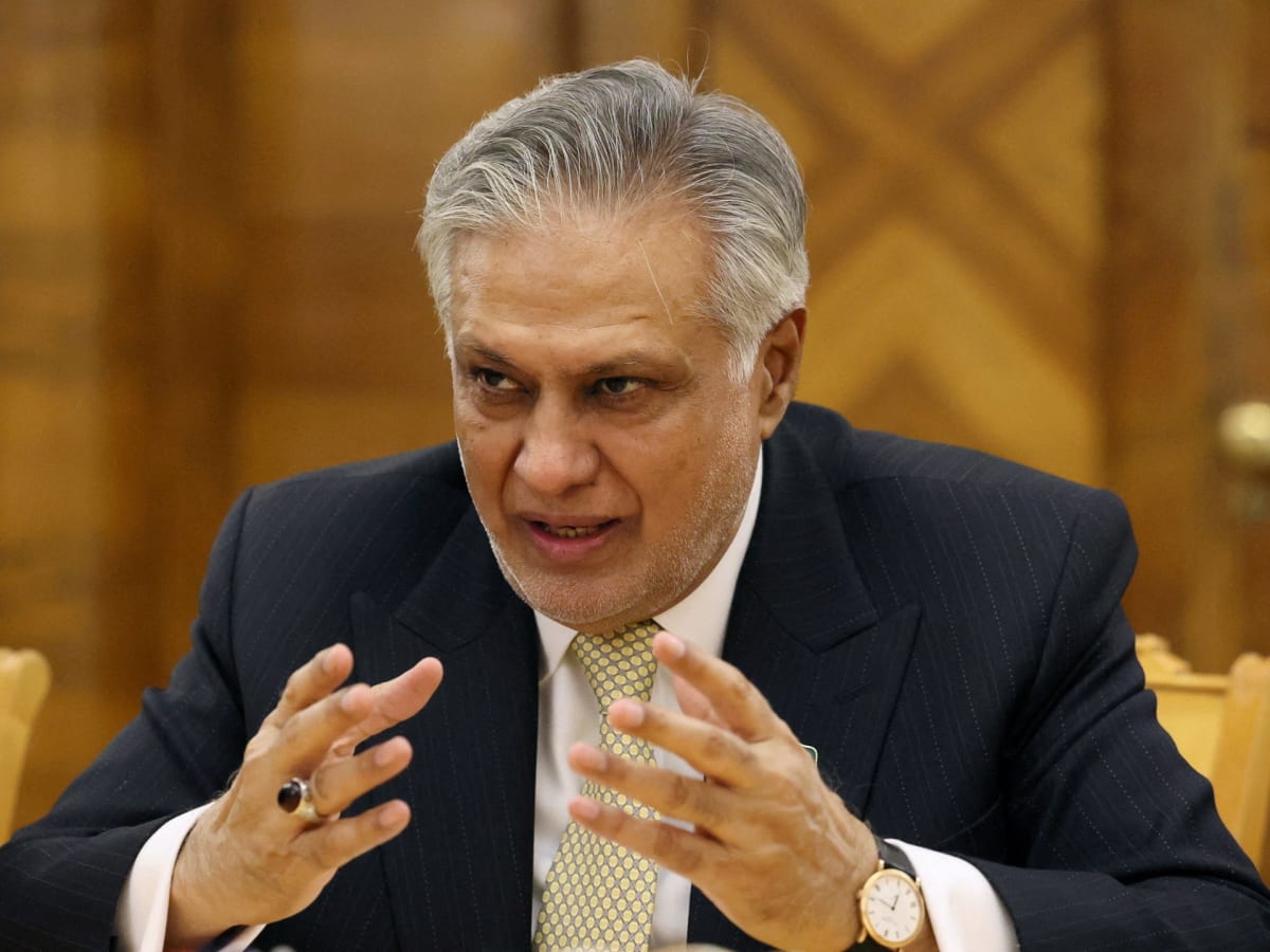 Container ships waiting in calm waters near the Strait of Hormuz shipping lane
