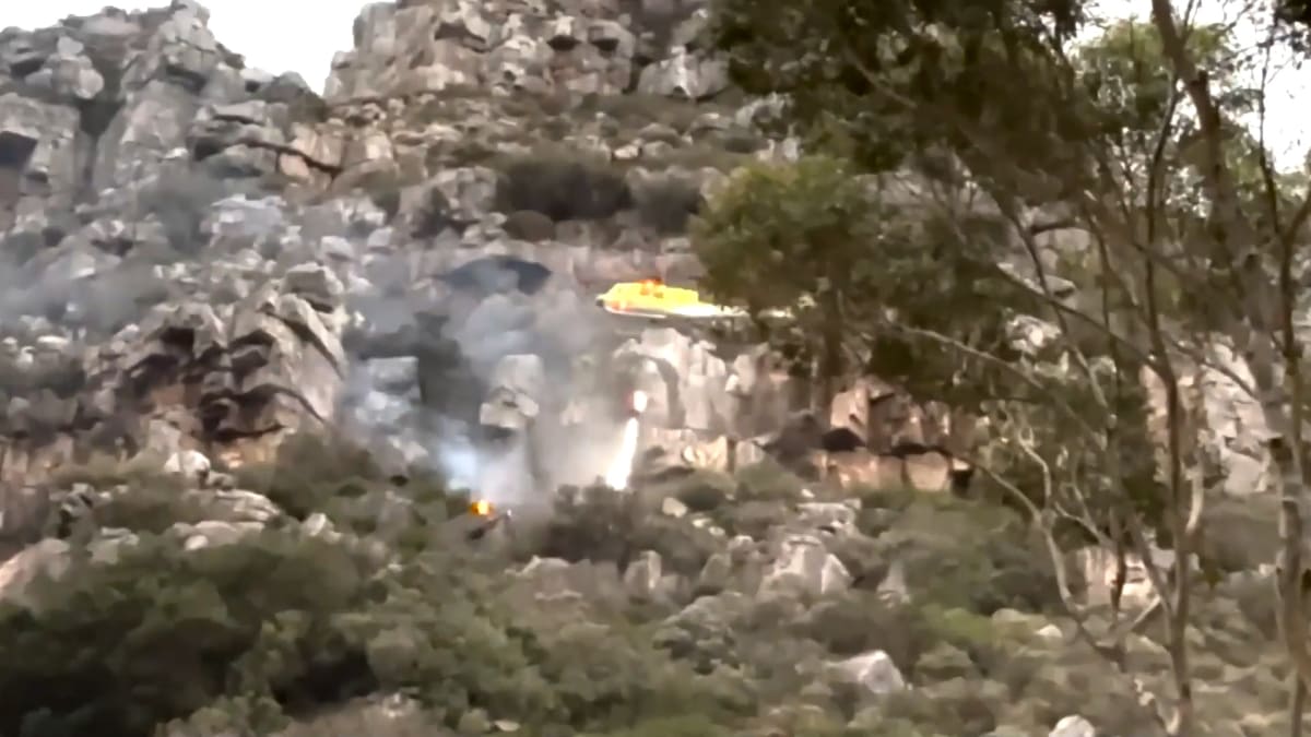 Firefighting helicopter crashed on ground near Hout Bay South Africa with pilots surviving