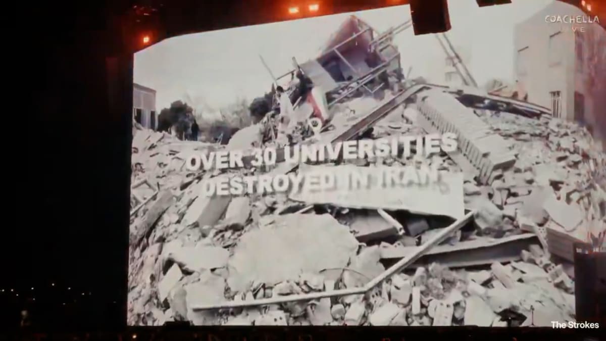 ** The Strokes performing on stage at Coachella festival with visual displays behind them