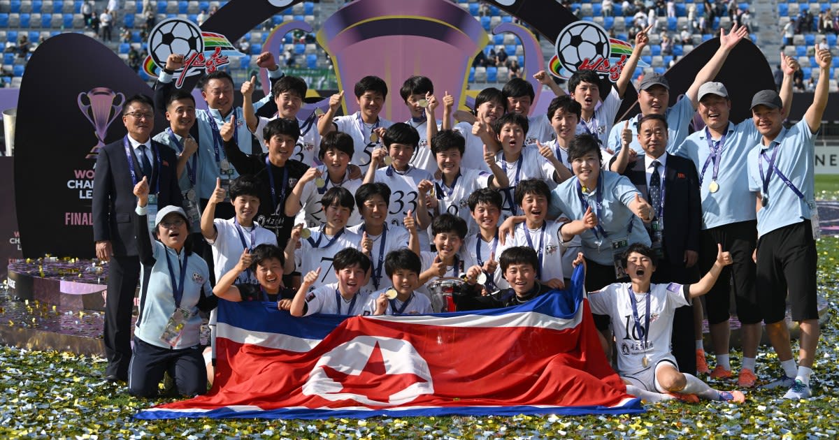 North Korean women's soccer team celebrates with trophy after winning Asian Champions League final