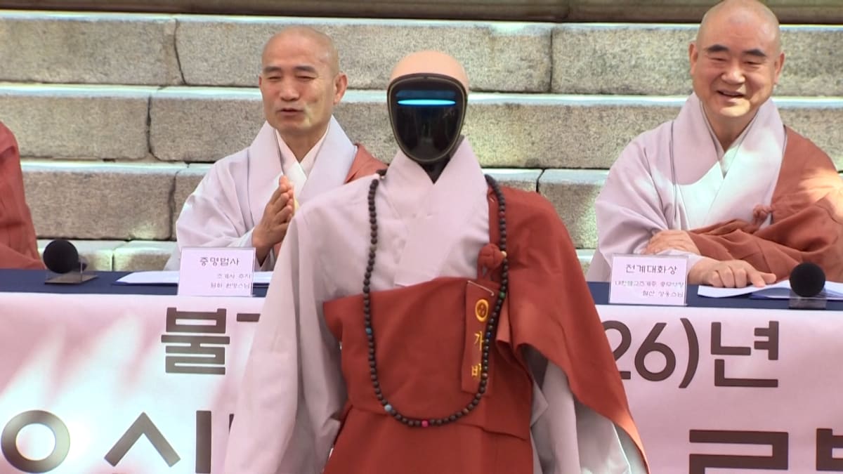 Humanoid robot Gabi in Buddhist robes during ordination ceremony at Seoul temple
