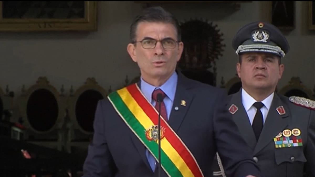 Bolivia's President Rodrigo Paz speaking at podium announcing salary reduction for government officials