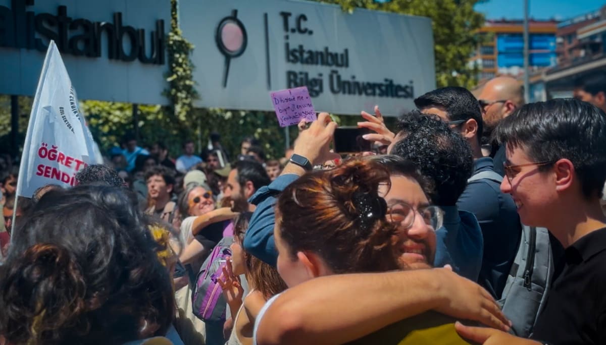 Istanbul Bilgi University students celebrating together on campus after successful protest