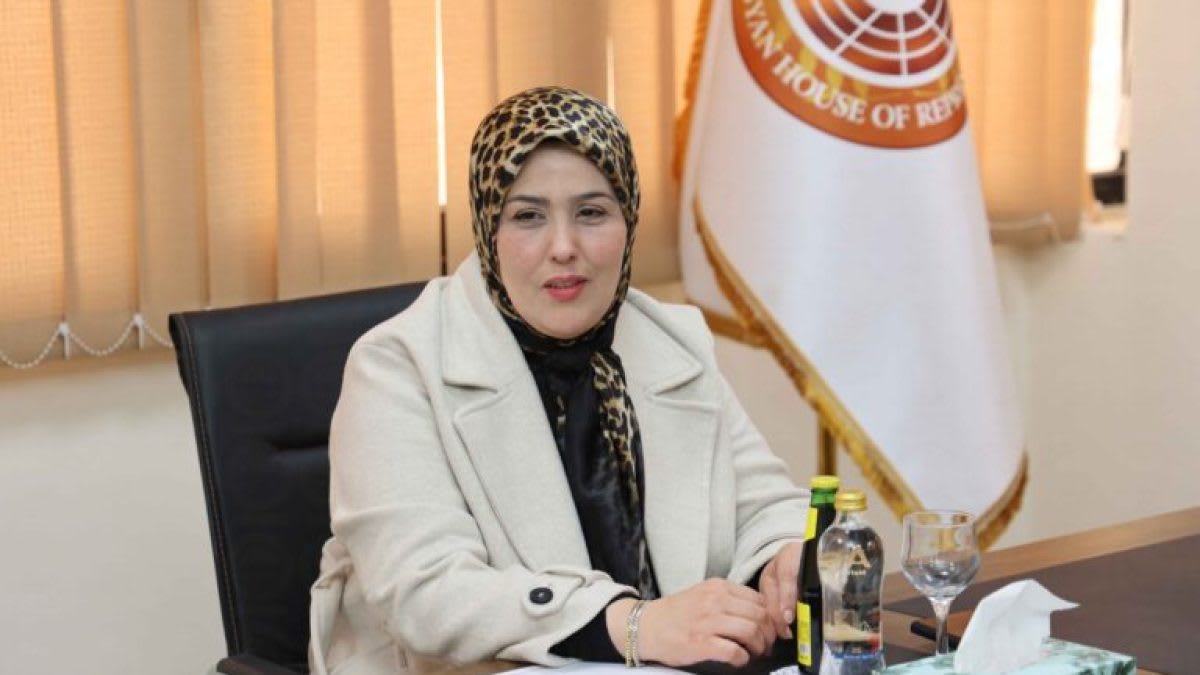 Intisar Shanib in professional attire during official government meeting in Libya