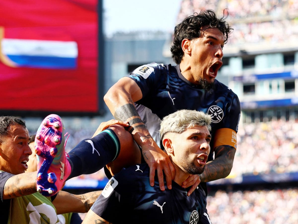 Paraguay's Jose Canale celebrates after scoring the winning penalty kick against Germany's goalkeeper