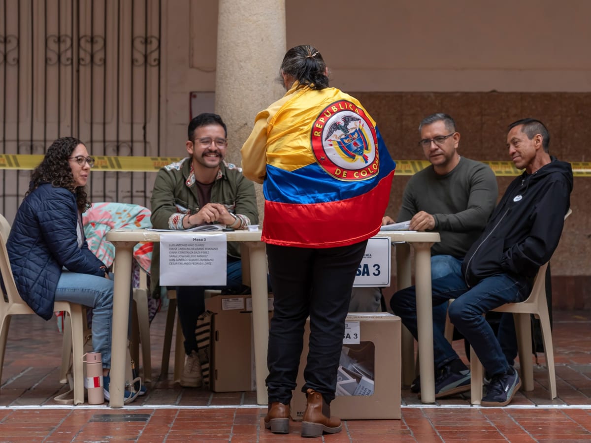 Voters casting ballots at polling station during Colombia's peaceful presidential election