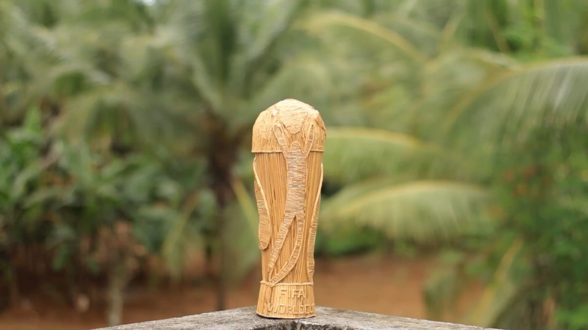 Handcrafted FIFA World Cup trophy replica made from coconut leaf ribs and recycled cardboard
