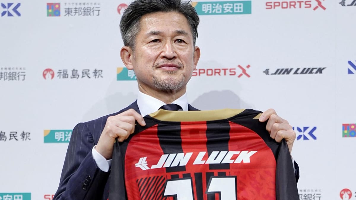 Kazuyoshi Miura in Fukushima United jersey celebrating goal on soccer field at age 59