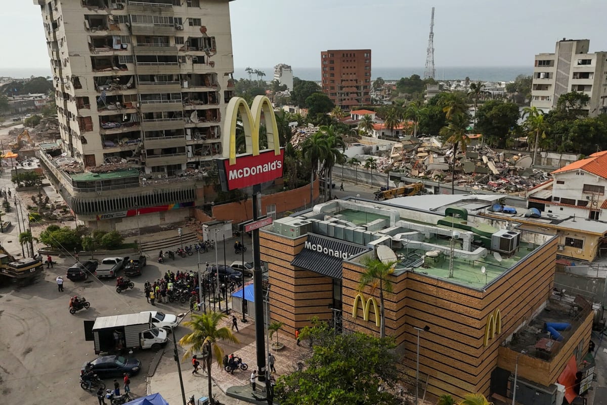 ** Venezuelan volunteer doctors treating patients inside converted fast-food restaurant serving as emergency clinic