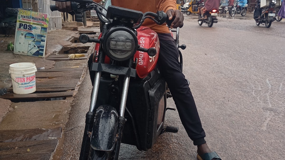 Electric motorcycle rider navigates street in Gombe, Nigeria amid rising fuel costs