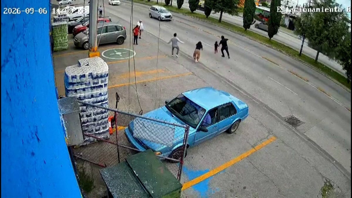 CCTV footage shows shop worker running into traffic to rescue child on busy street