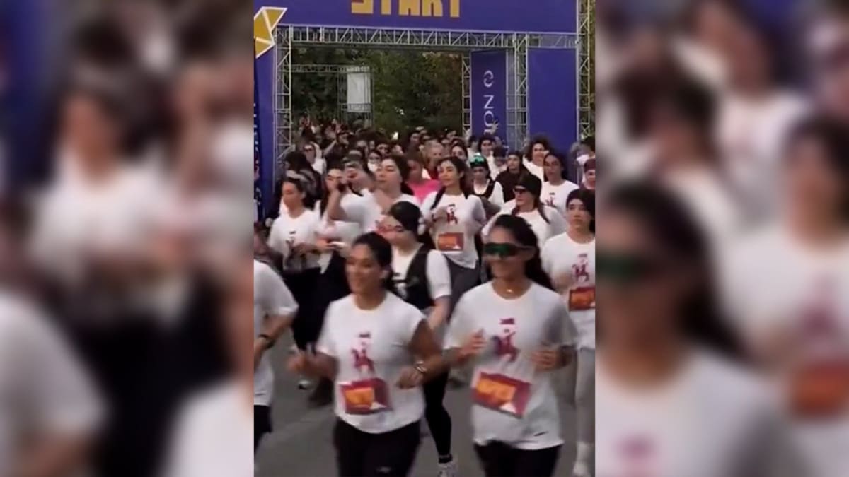 ** Iranian women running through Tehran streets with hair uncovered during public race