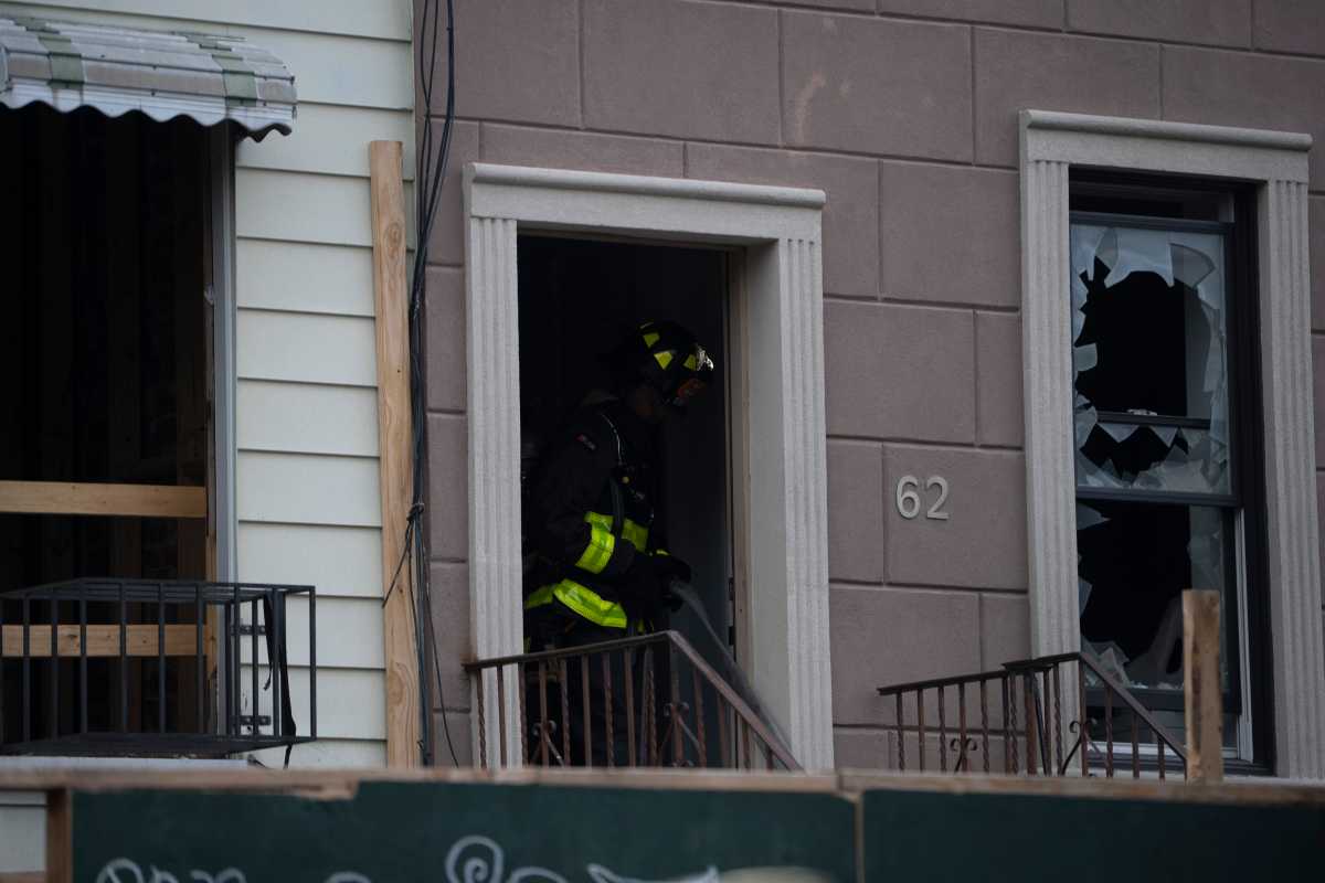 Firefighters battle three-alarm blaze with smoke rising from Brooklyn residential building rooftop