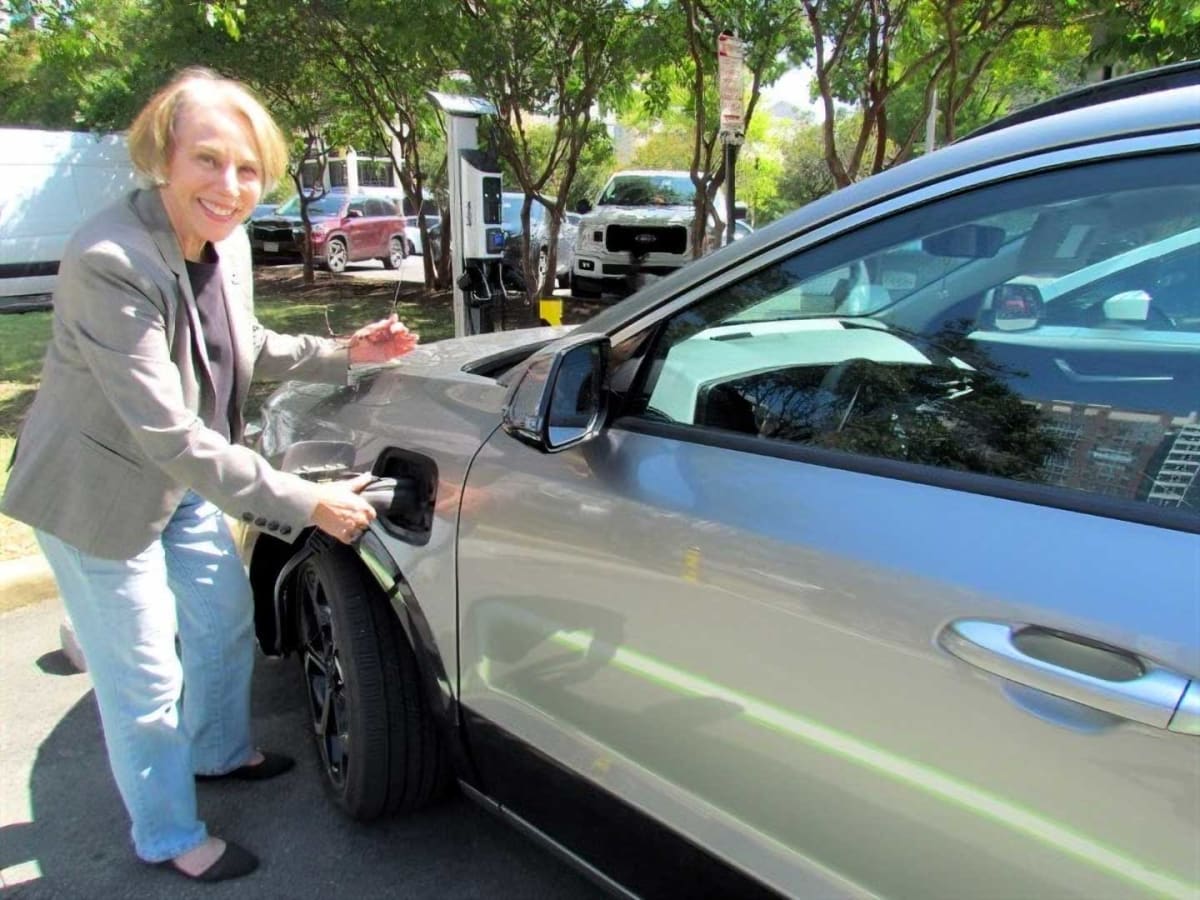 Electric vehicle charging station mounted on apartment building exterior wall in Arlington, Virginia