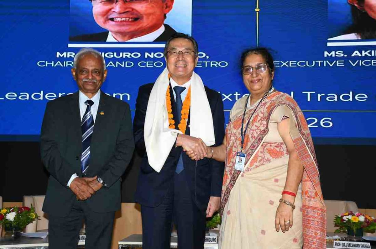 Japanese and Indian education leaders shaking hands at Amity University campus event