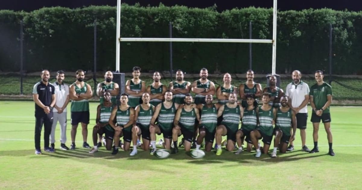 Saudi Arabian rugby players training together on field in preparation for international match