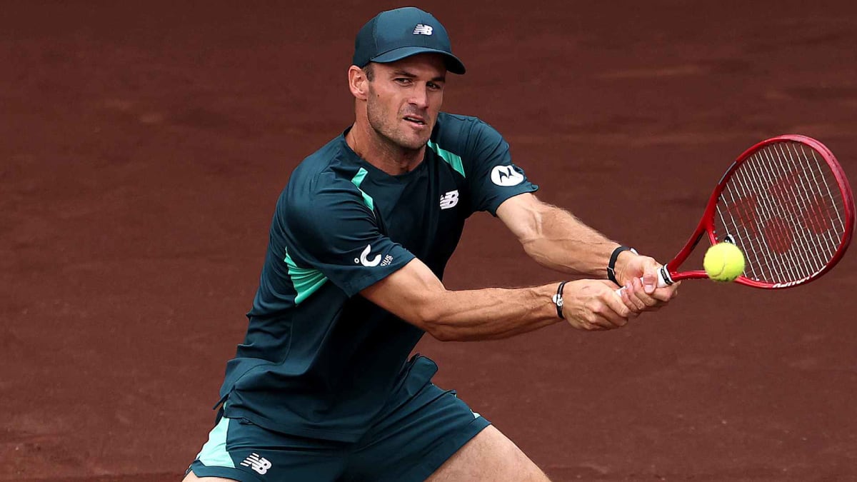 Tommy Paul celebrates with trophy after dramatic comeback victory in Houston tennis tournament
