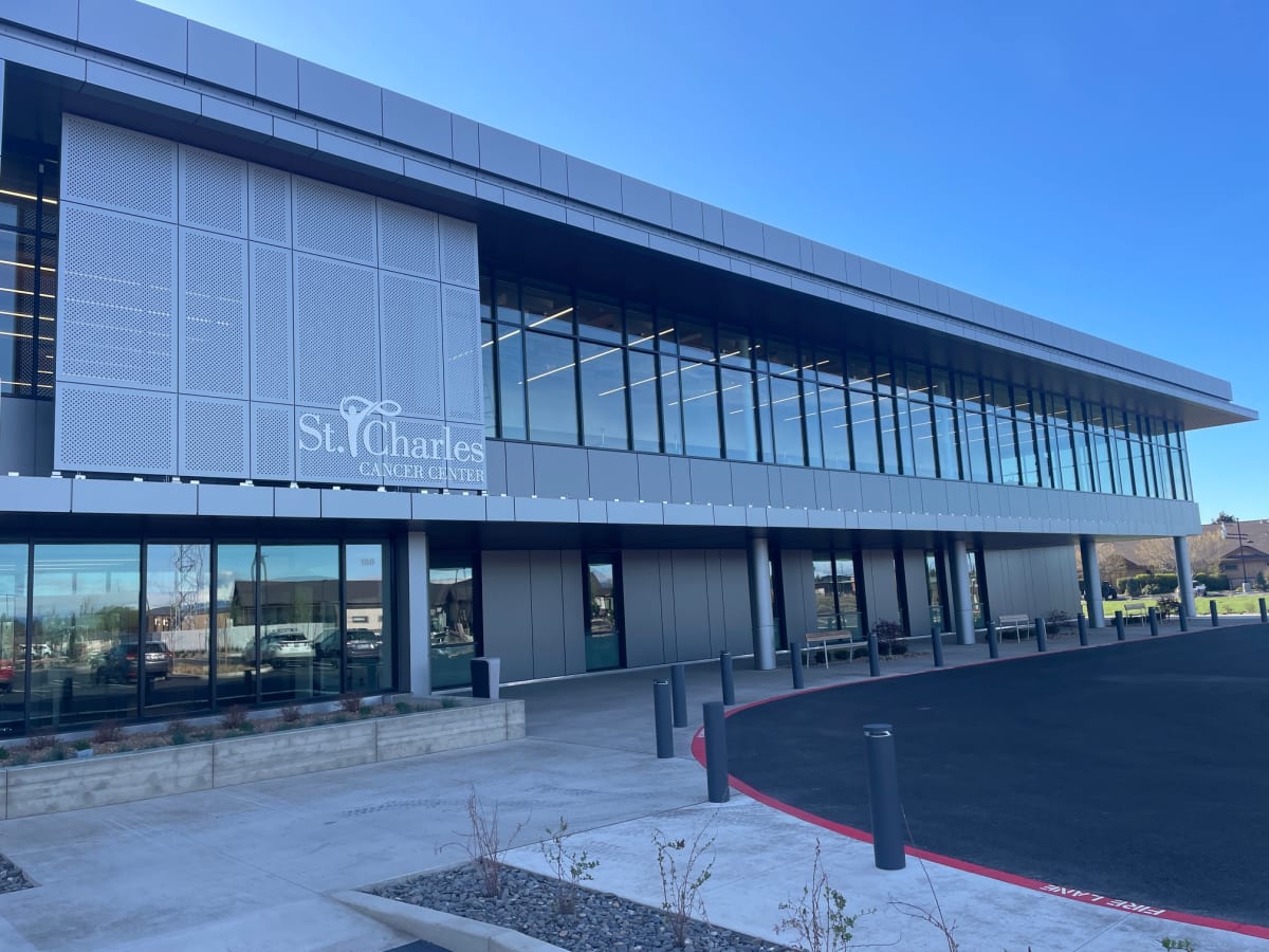 Modern two-story St. Charles cancer treatment center building exterior in Redmond, Oregon