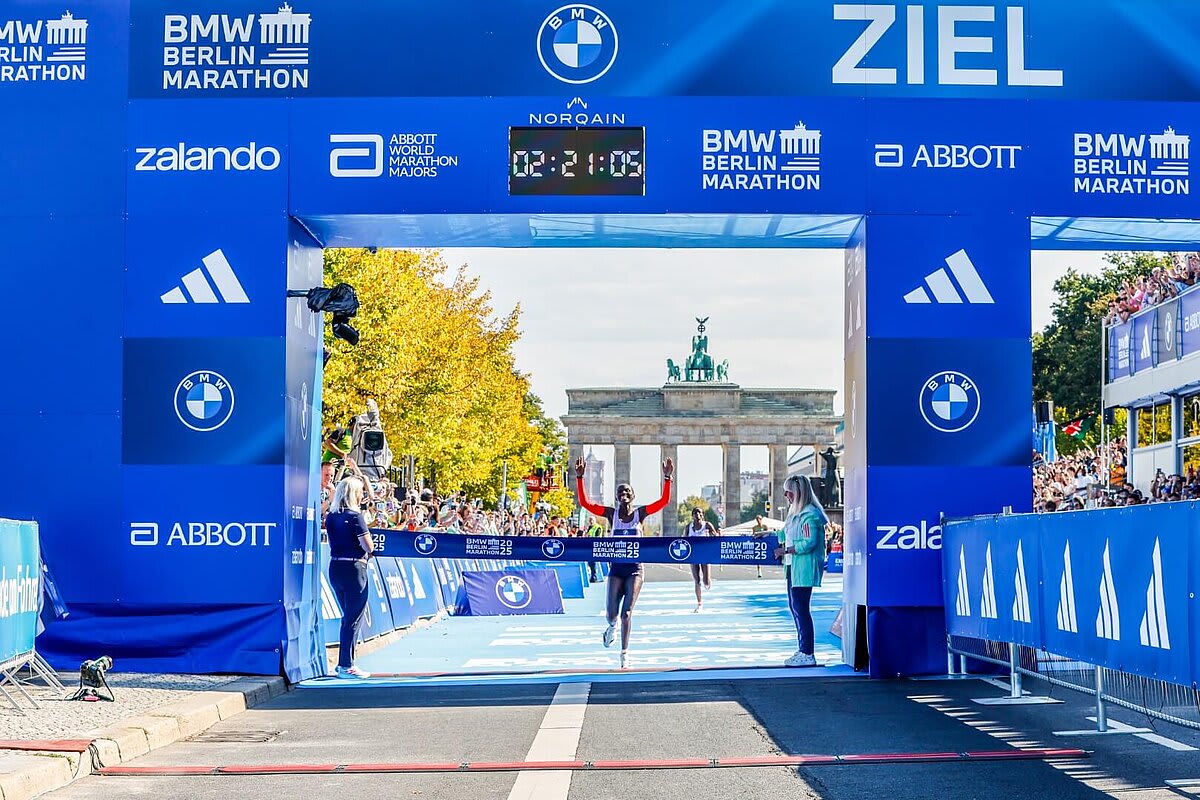 Kenyan marathoner Sabastian Sawe running through Berlin streets during record-breaking race performance