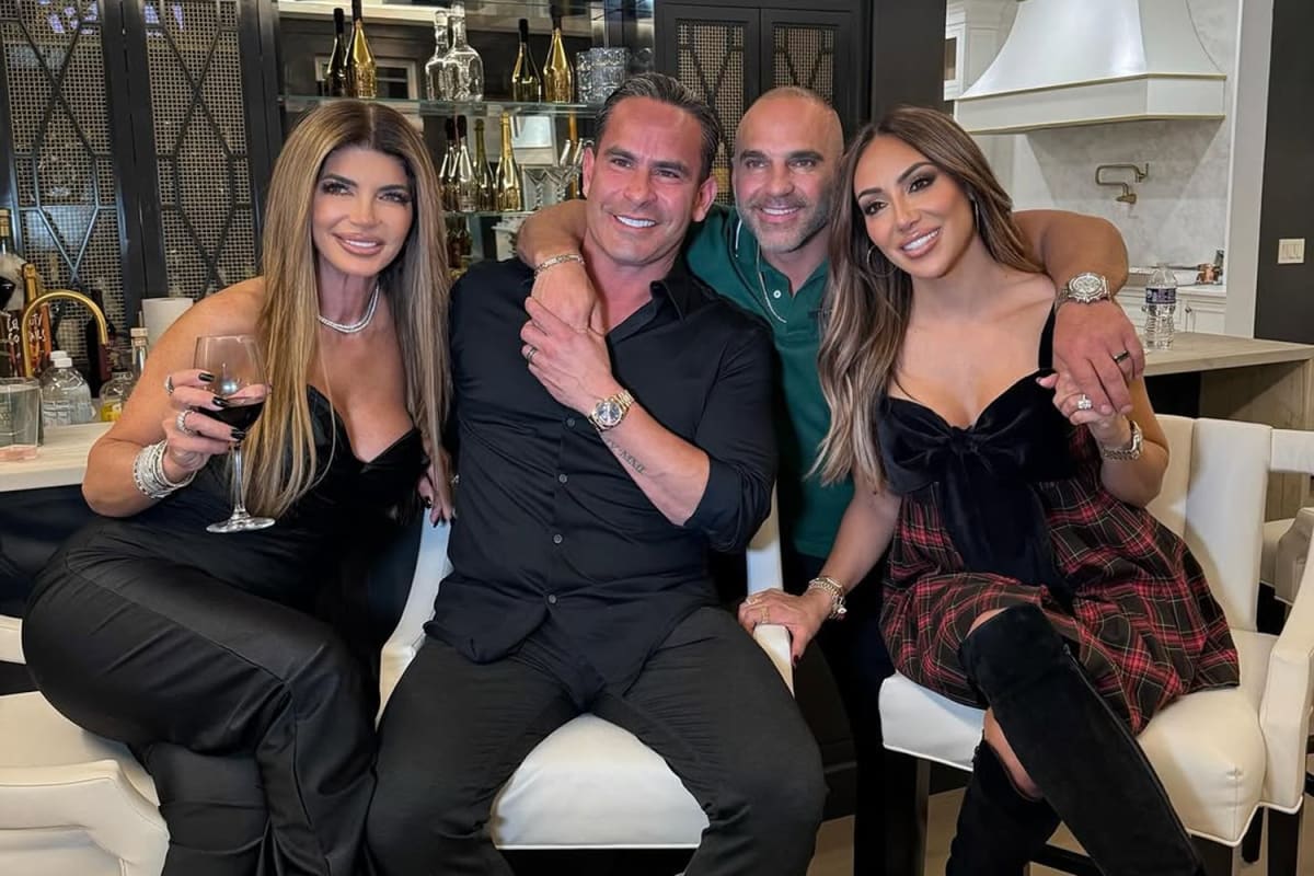 Joe Gorga and Teresa Giudice smiling together at family event after reconciliation