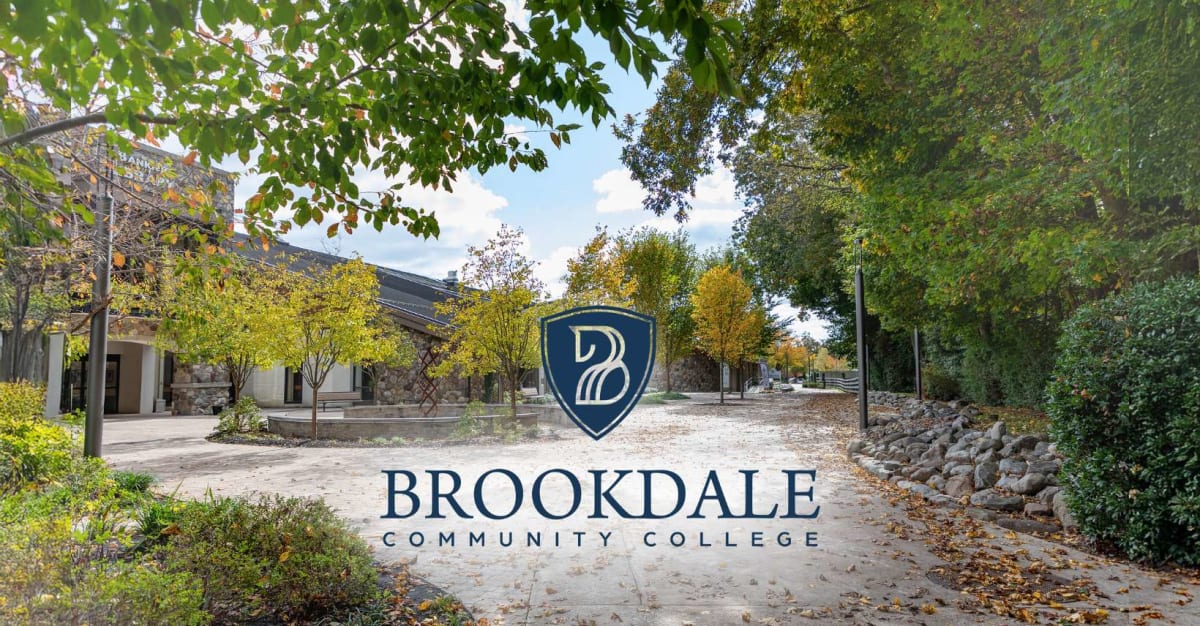 Three smiling Brookdale Community College students being honored at academic achievement awards ceremony