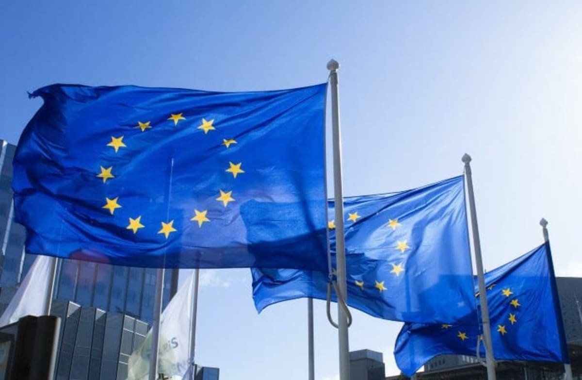 European Union flag waving against blue sky representing Malaysia-EU partnership agreement