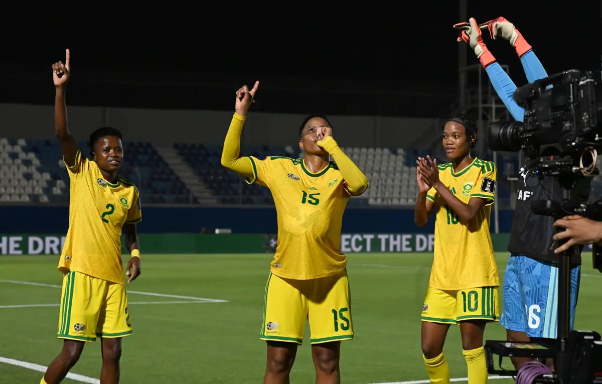 South African women's soccer team celebrating victory during World Cup qualifying match against Nigeria