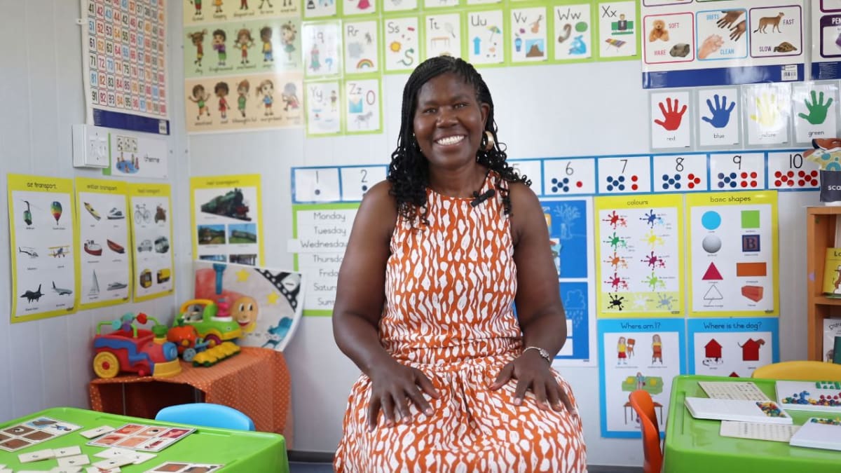Mthwakazi Nancy Soqaka standing outside Grow Buddies Preschool in Khayelitsha, South Africa